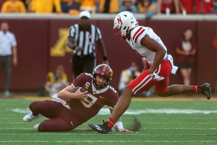 Nebraska Minnesota 2023 - Athan Kaliakmanis slides to avoid tackle